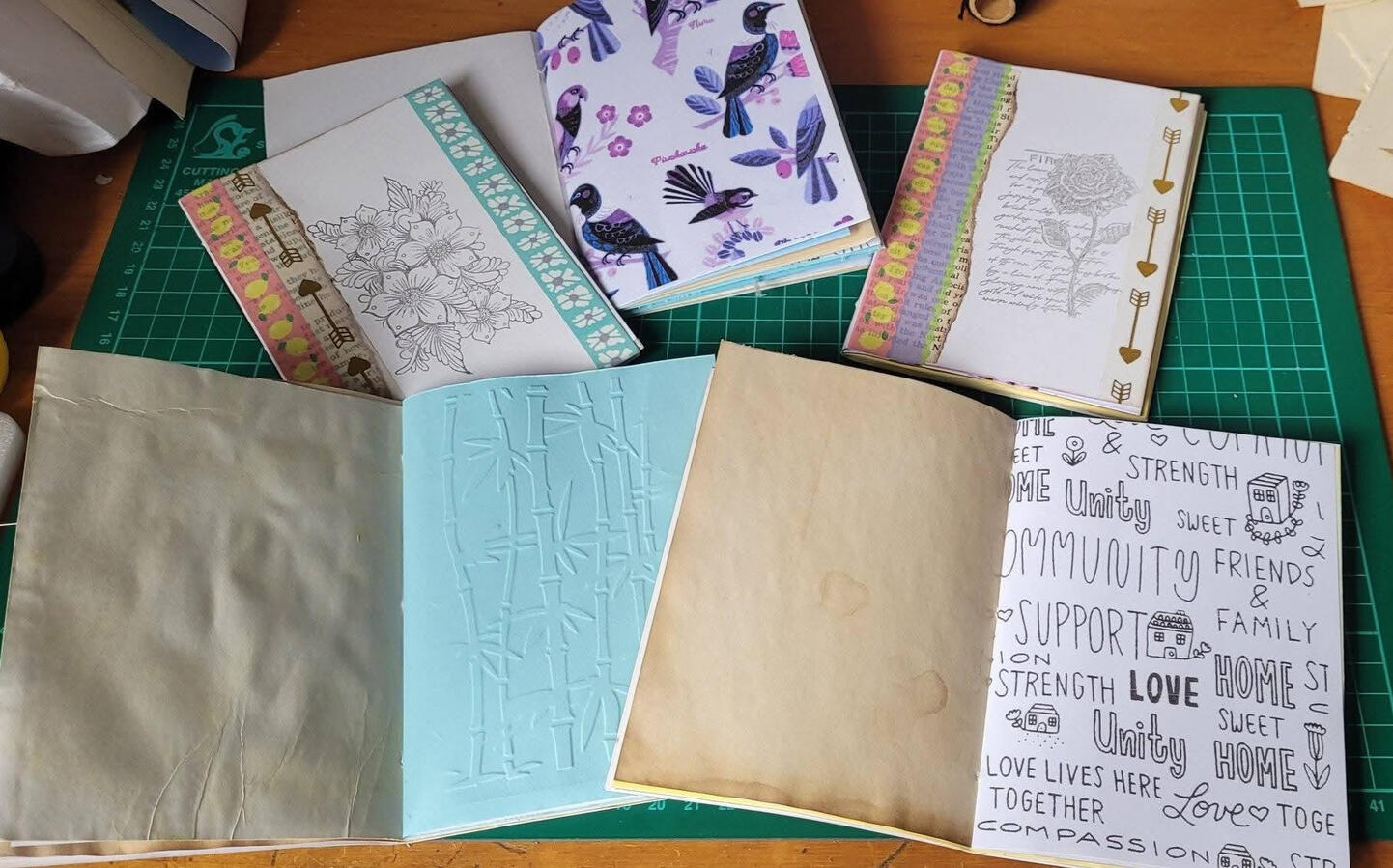 Showing a selection of various journals with their insides showing. Showing a selection of various journals with their insides showing.